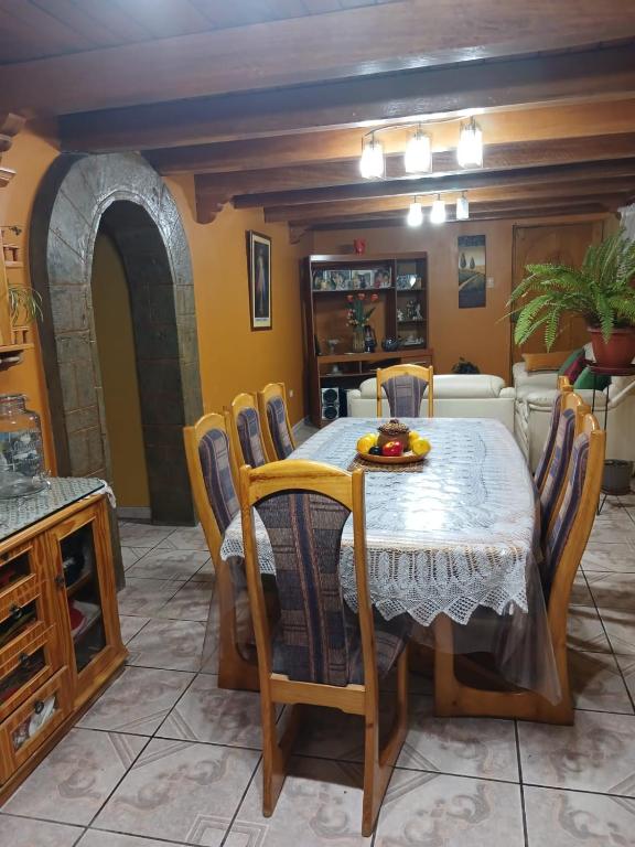 a dining room with a table and chairs at Depa amoblado Samana Cruz in Cajamarca