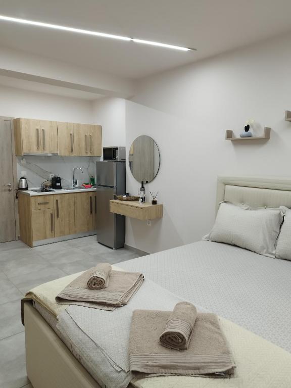 a bedroom with a bed with two towels on it at F&M House Semi Basement in Sarti