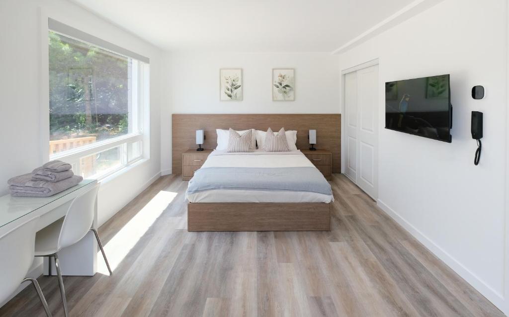 Postel nebo postele na pokoji v ubytování Stay Inn Muskoka