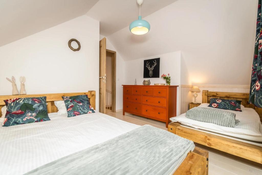 Postel nebo postele na pokoji v ubytování Domek na Kaszubach 21-2 - Ostoja Bukowo