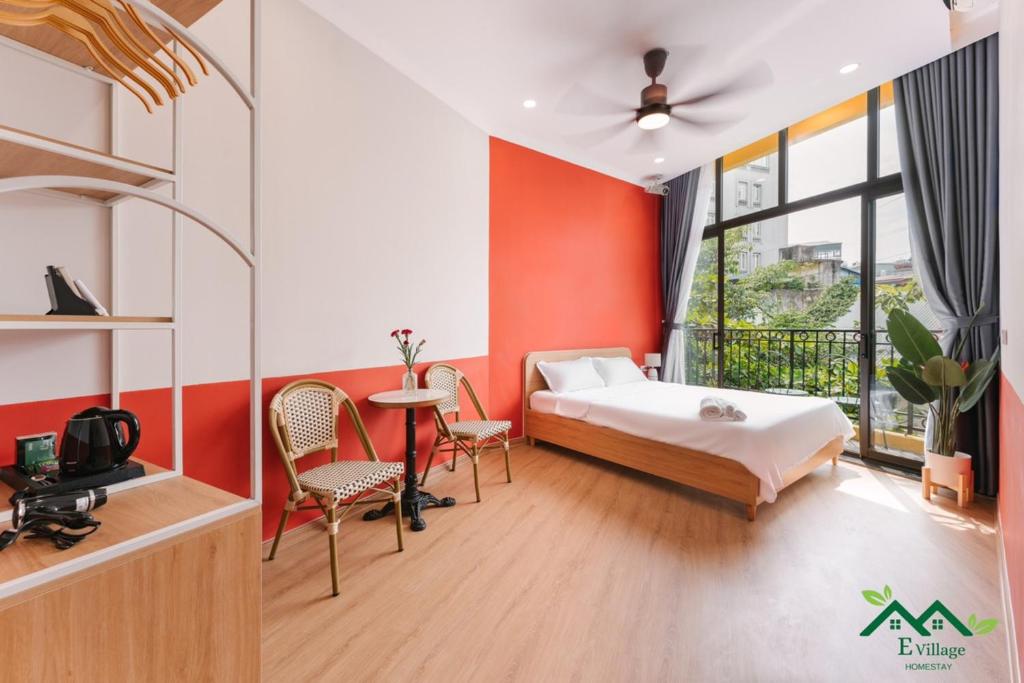 Postel nebo postele na pokoji v ubytování E Village Hotel Hanoi