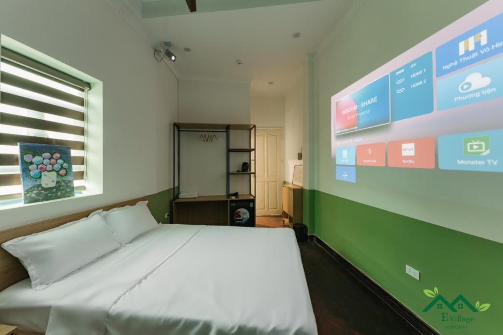 Postel nebo postele na pokoji v ubytování E Village Hotel Hanoi