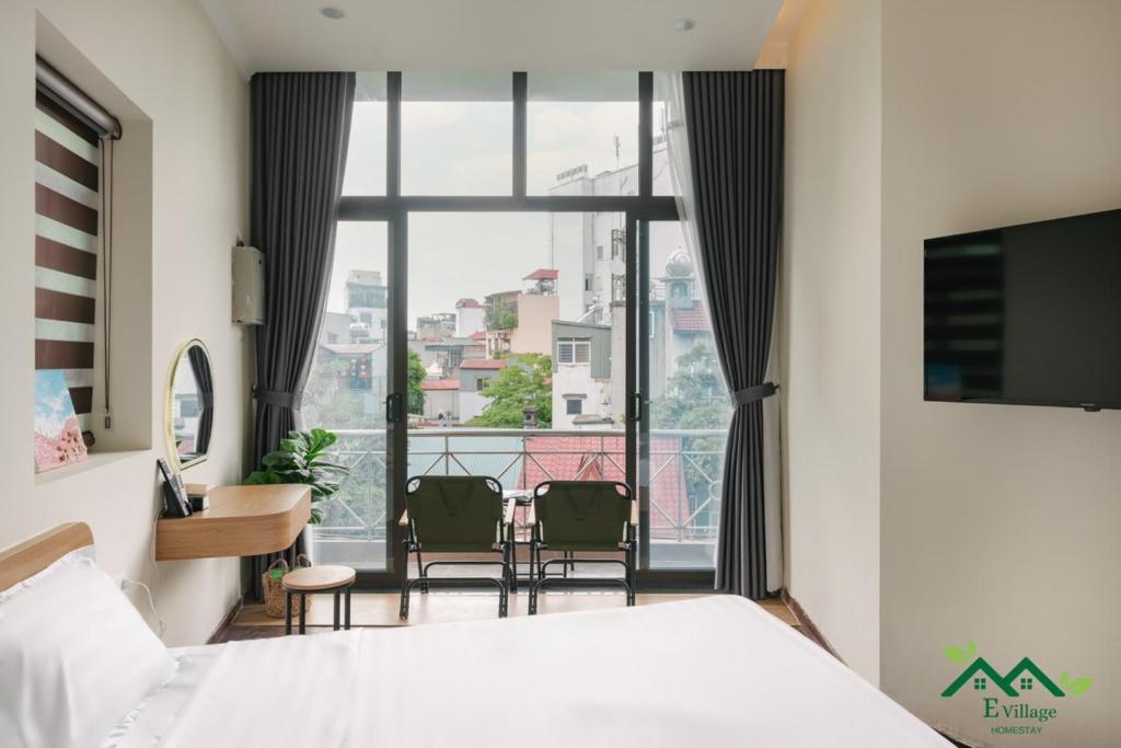 TV a/nebo společenská místnost v ubytování E Village Hotel Hanoi