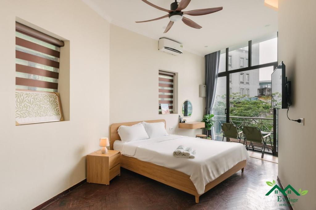 Postel nebo postele na pokoji v ubytování E Village Hotel Hanoi