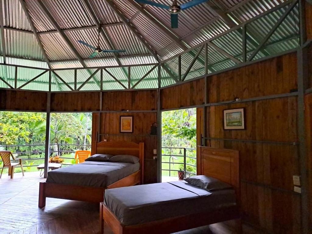Un ou plusieurs lits dans un hébergement de l'établissement La Amapola Lodge, Bungalow en Península de Osa.