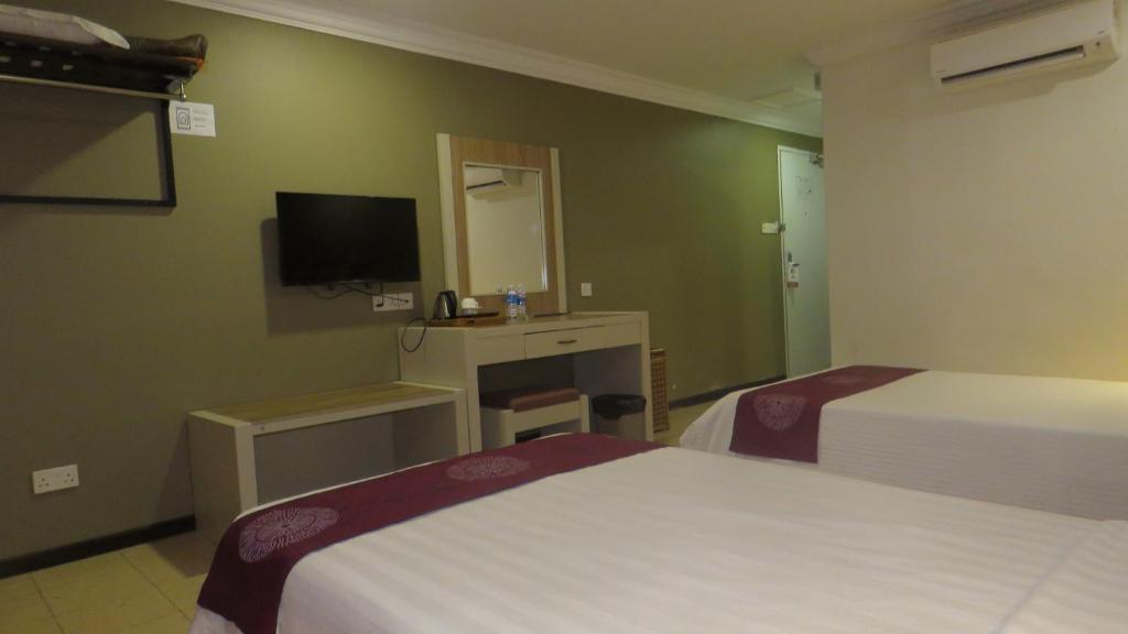 Postel nebo postele na pokoji v ubytování Heritage Hotel