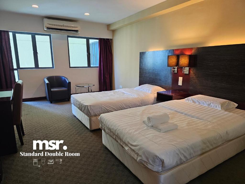 Postel nebo postele na pokoji v ubytování Kota Kinabalu City Ensuite at SCSP Ming Garden