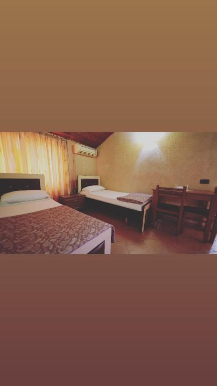 Postel nebo postele na pokoji v ubytování Alen Bar Hotel