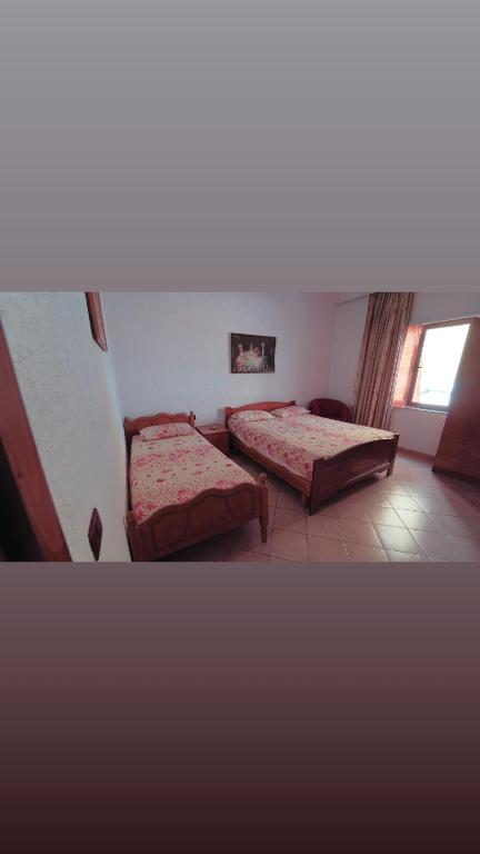 Postel nebo postele na pokoji v ubytování Alen Bar Hotel