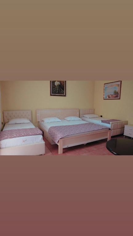 Postel nebo postele na pokoji v ubytování Alen Bar Hotel