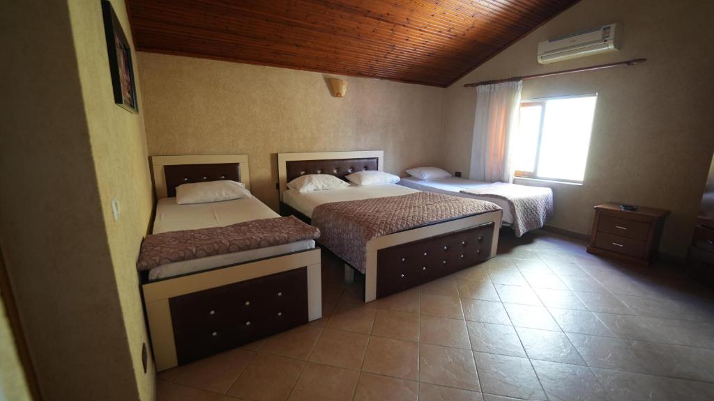 Postel nebo postele na pokoji v ubytování Alen Bar Hotel
