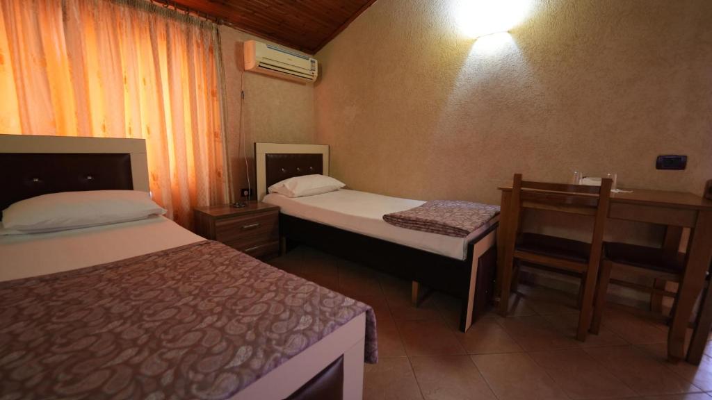 Postel nebo postele na pokoji v ubytování Alen Bar Hotel