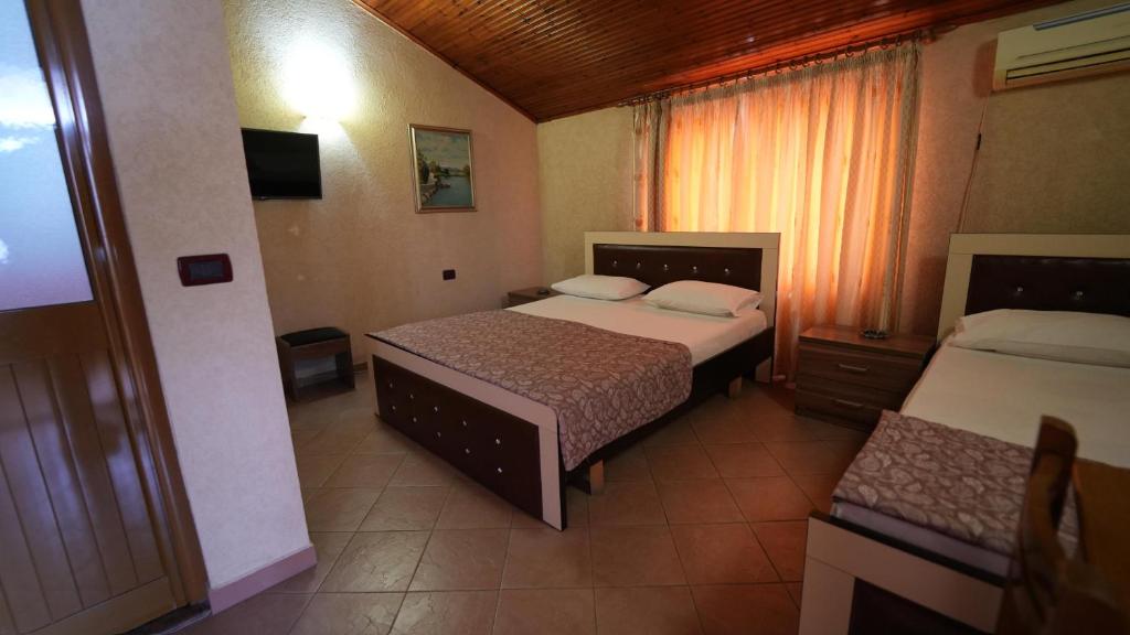 Postel nebo postele na pokoji v ubytování Alen Bar Hotel