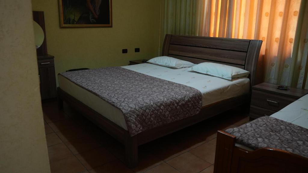 Postel nebo postele na pokoji v ubytování Alen Bar Hotel