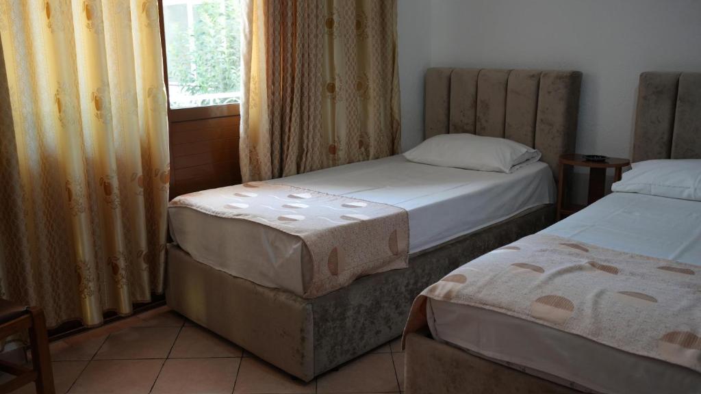 Postel nebo postele na pokoji v ubytování Alen Bar Hotel