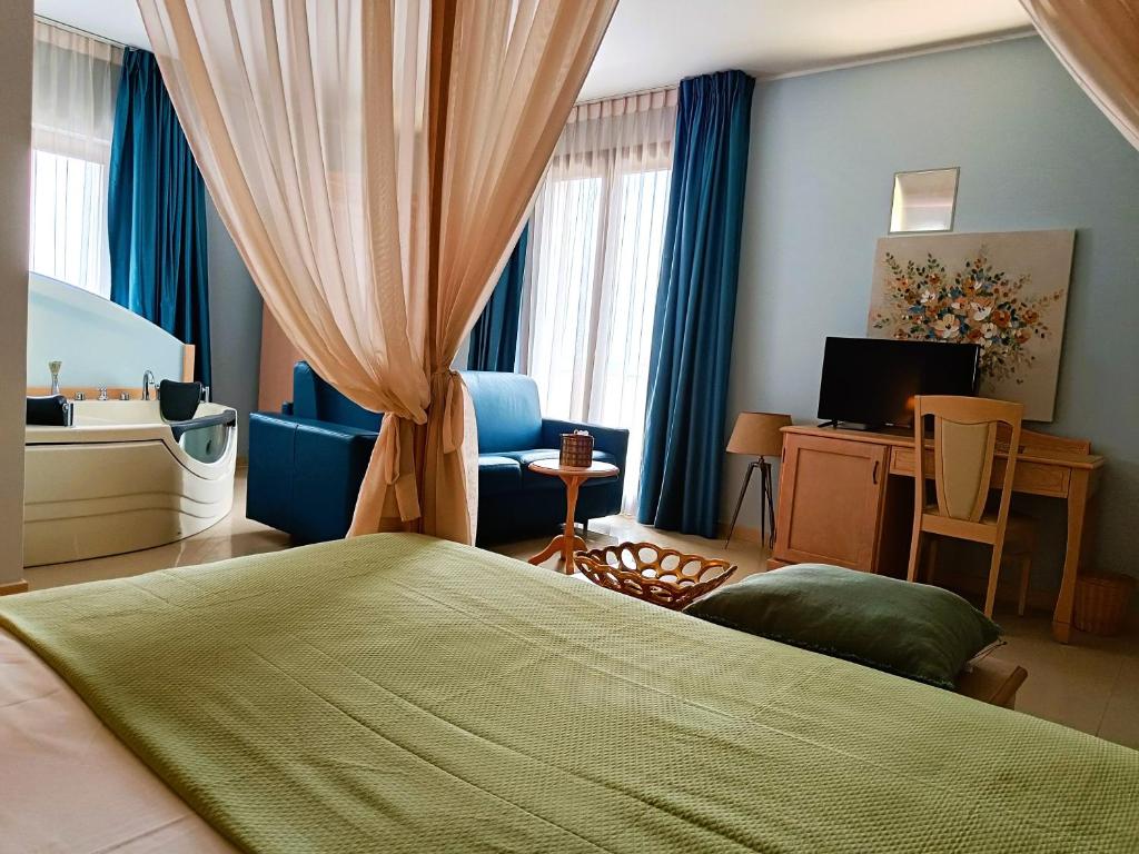 Postel nebo postele na pokoji v ubytování UNICO Albatres Palace Salento by Life Resorts