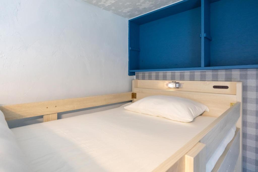 Postel nebo postele na pokoji v ubytování nest Olive Atami