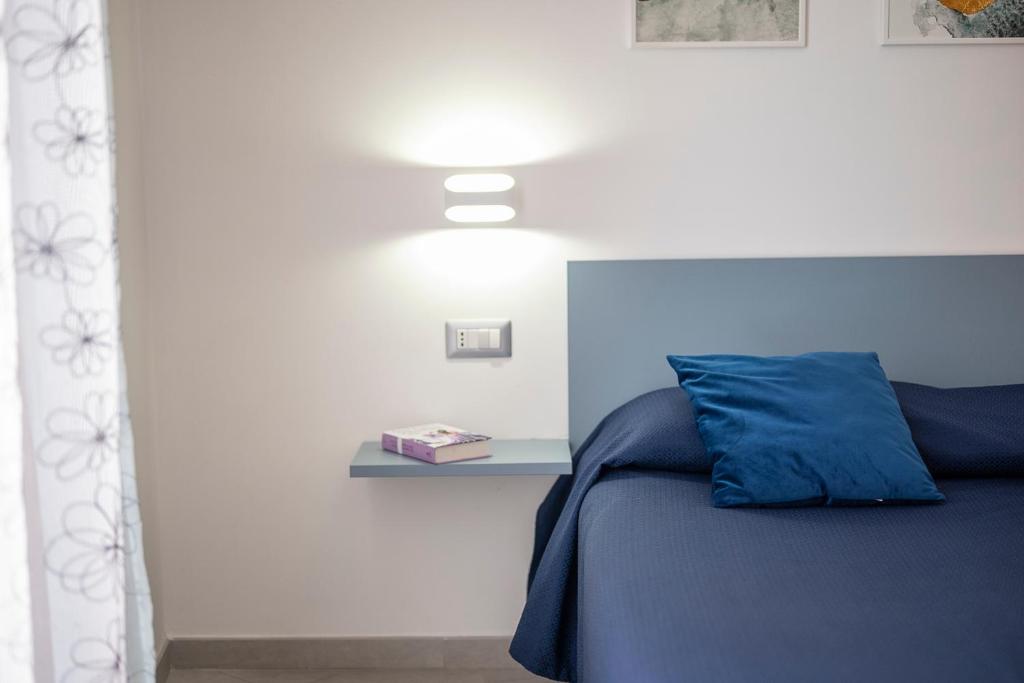 Posteľ alebo postele v izbe v ubytovaní Dimora Asmara 11 15
