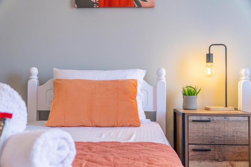 Postel nebo postele na pokoji v ubytování Maestro Apartment
