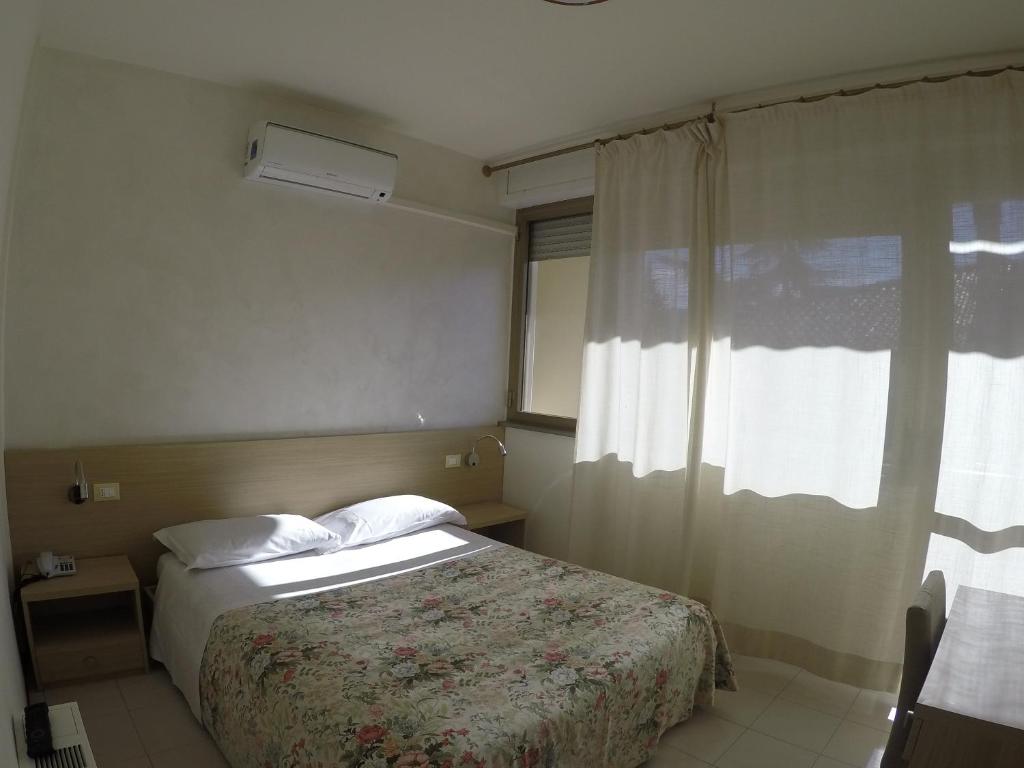 Postel nebo postele na pokoji v ubytování Albergo Nyers