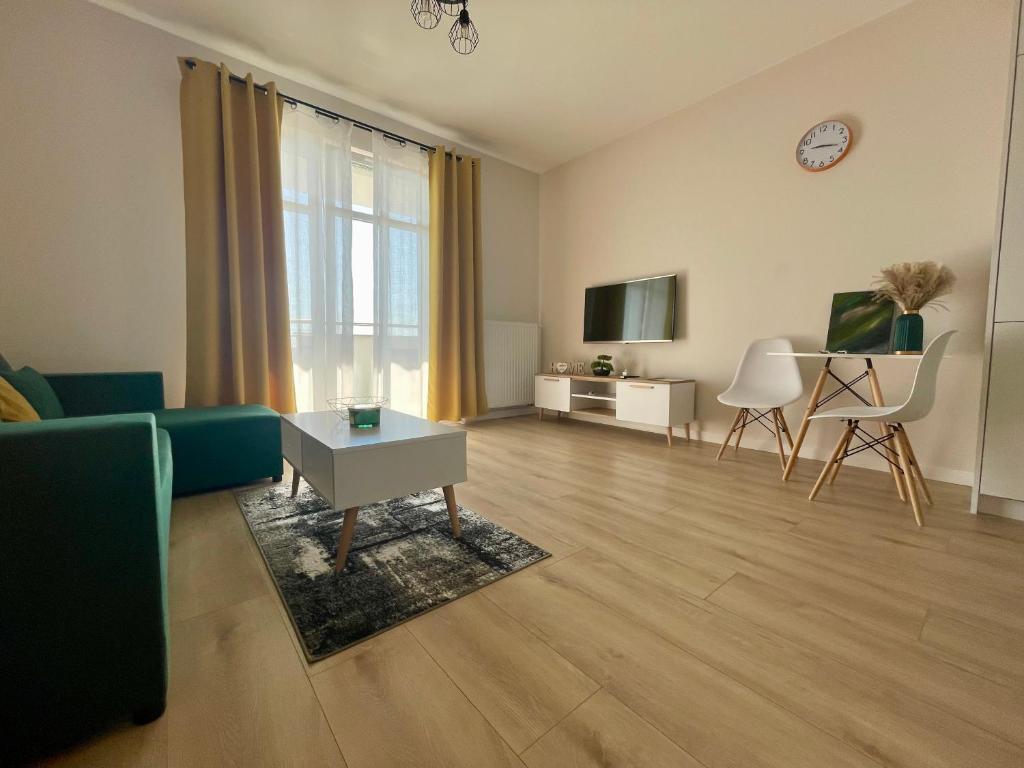 TV a/nebo společenská místnost v ubytování Apartament Pirat
