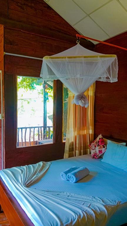 Postel nebo postele na pokoji v ubytování Sigiri Sky Home & TreeHouse