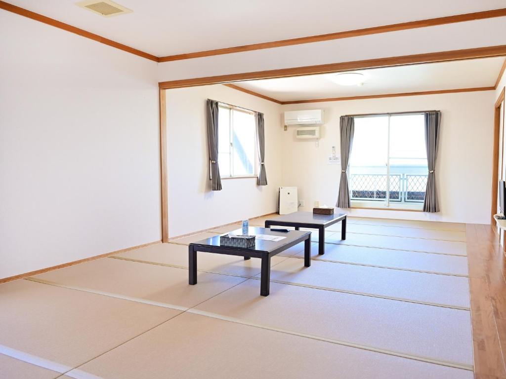 two tables in a room with two windows at Pension B,B, Dylan - Vacation STAY 22453v in Otsu