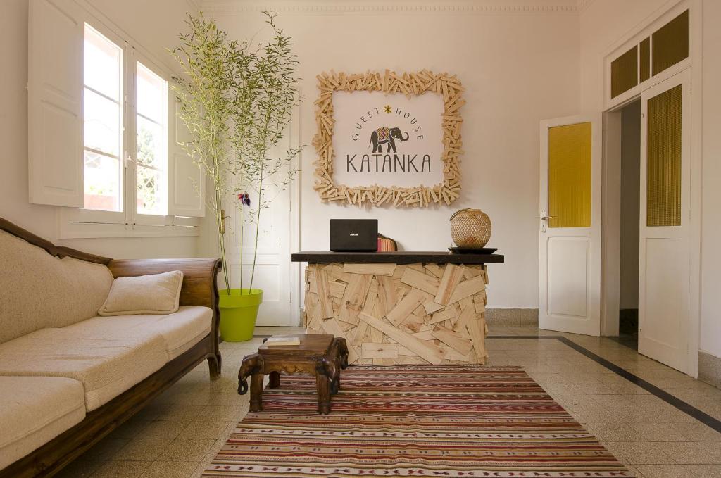 a living room filled with furniture and a piano at Guesthouse Katanka in Las Palmas de Gran Canaria