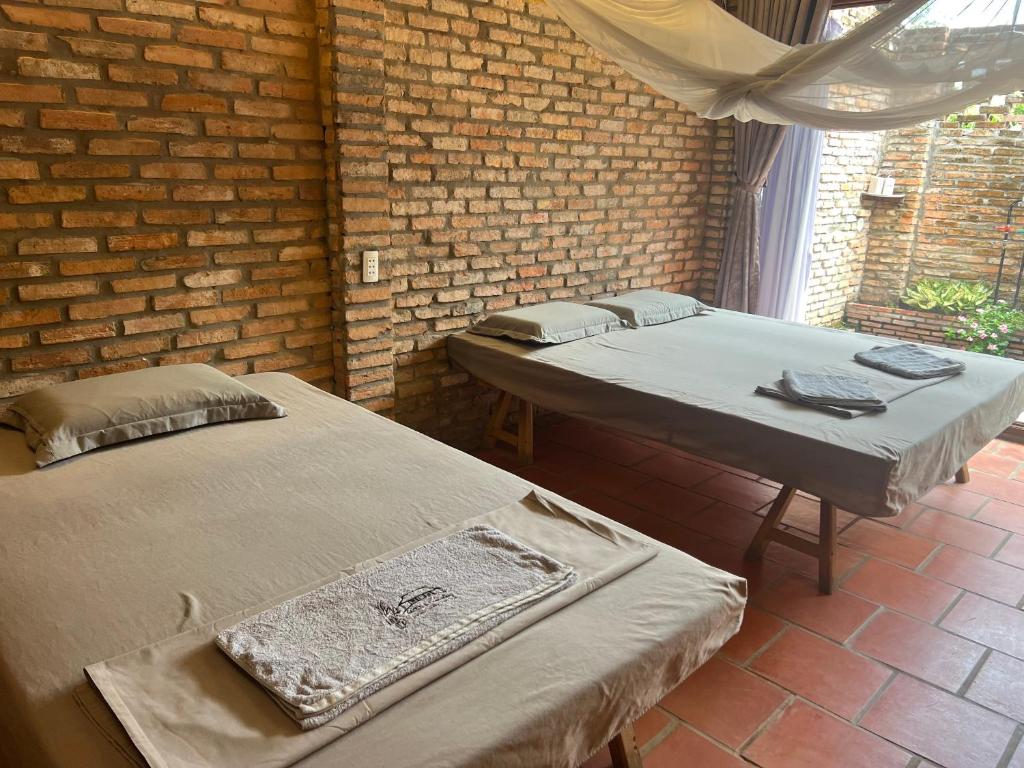 Postel nebo postele na pokoji v ubytování Út Quỳnh Homestay