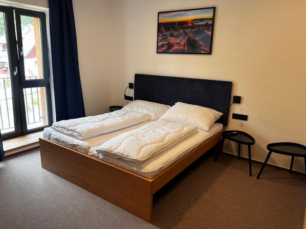 Postel nebo postele na pokoji v ubytování Apartmány Šestka