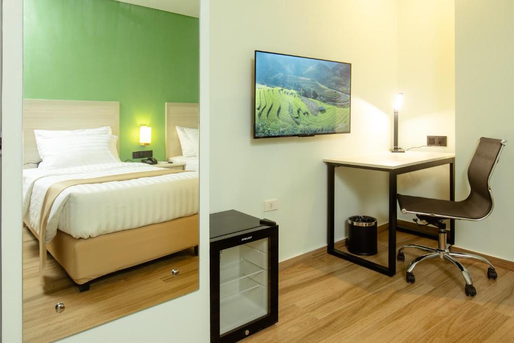 Postel nebo postele na pokoji v ubytování Hamersons Hotel CDO