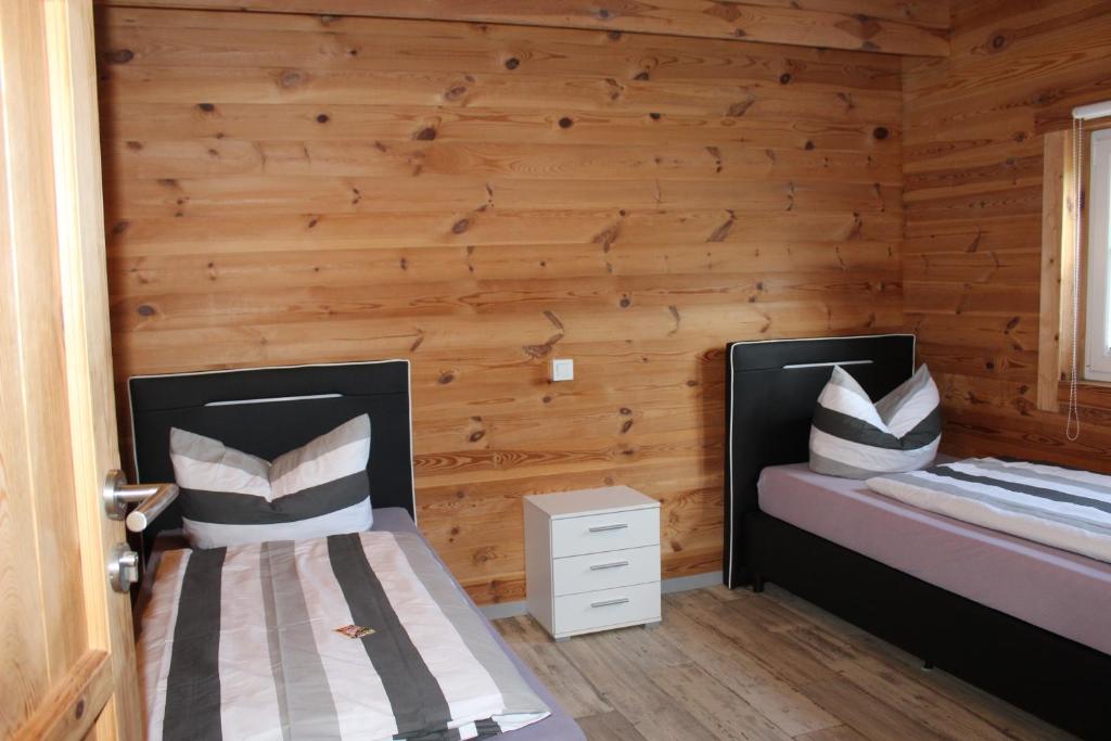 Postel nebo postele na pokoji v ubytování Ferienhaus Harmonie, Sauna,Seeblick, familienfreundlich
