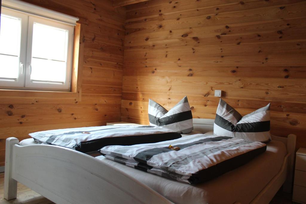 Postel nebo postele na pokoji v ubytování Ferienhaus Harmonie, Sauna,Seeblick, familienfreundlich