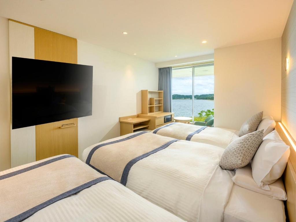 Postel nebo postele na pokoji v ubytování KAMENOI HOTEL Hikone
