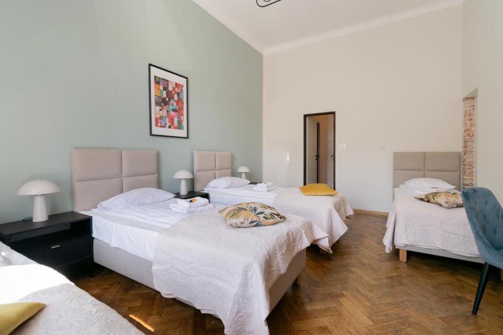 Posteľ alebo postele v izbe v ubytovaní Apartments Studencka Street, Next to Planty Park
