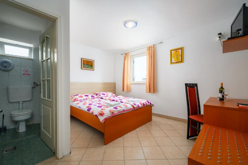Postel nebo postele na pokoji v ubytování Ven Apartmani