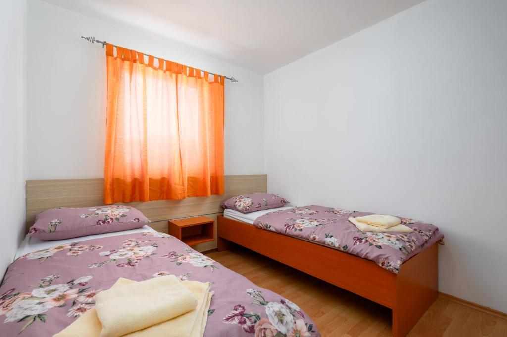 Postel nebo postele na pokoji v ubytování Ven Apartmani