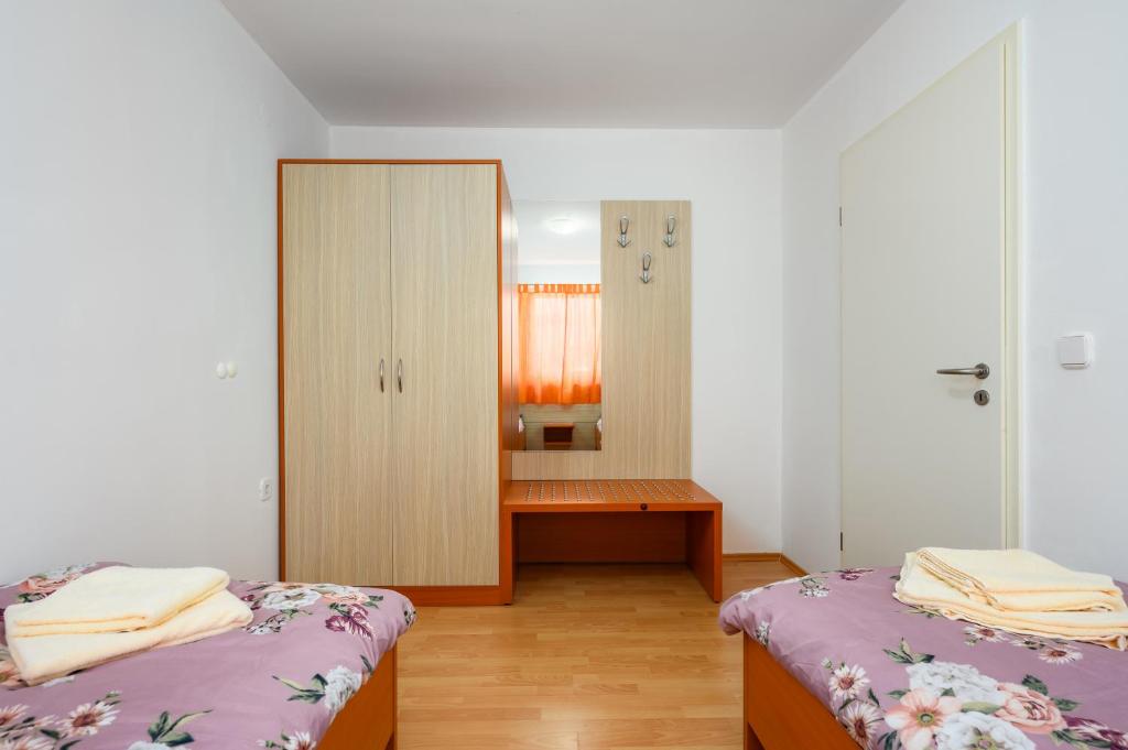 Postel nebo postele na pokoji v ubytování Ven Apartmani