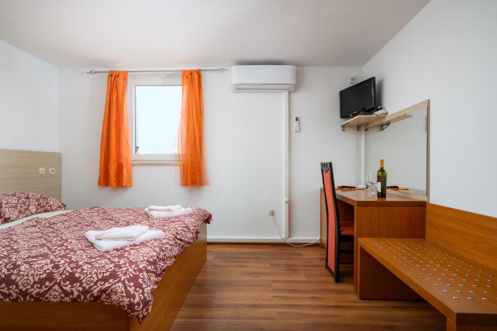 Postel nebo postele na pokoji v ubytování Ven Apartmani