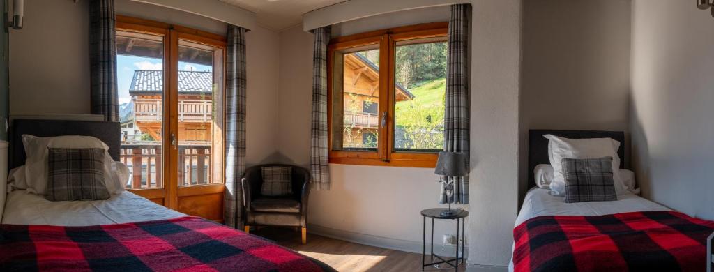 Postel nebo postele na pokoji v ubytování Hotel La Renardière Morzine