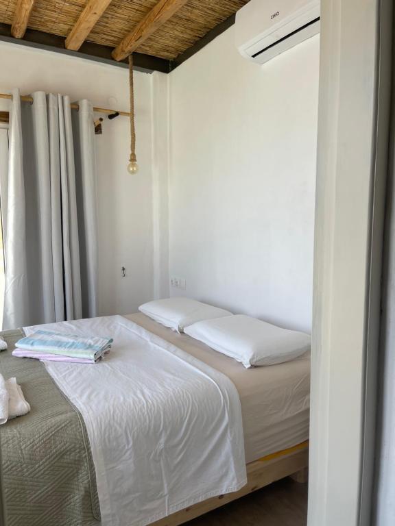 Łóżko lub łóżka w pokoju w obiekcie Venereum Apartments