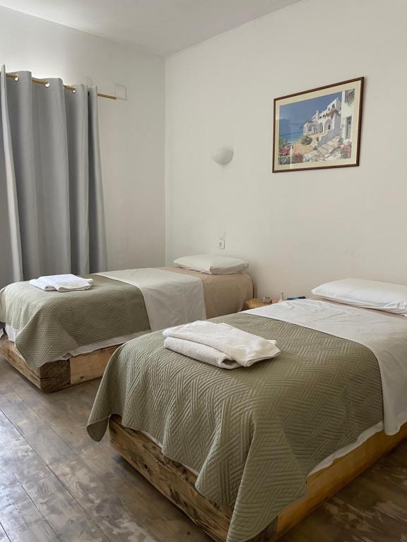 Łóżko lub łóżka w pokoju w obiekcie Venereum Apartments