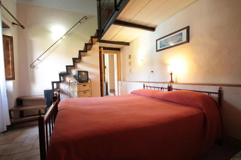 Un pat sau paturi într-o cameră la Casa Castellina
