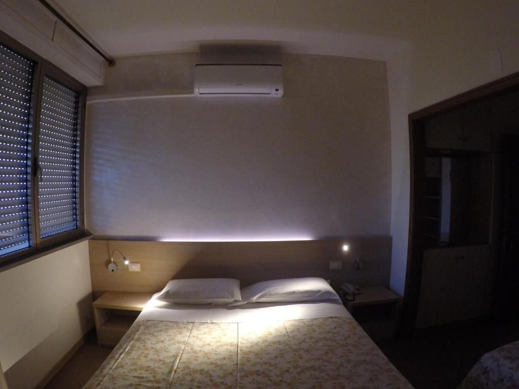 Postel nebo postele na pokoji v ubytování Albergo Nyers