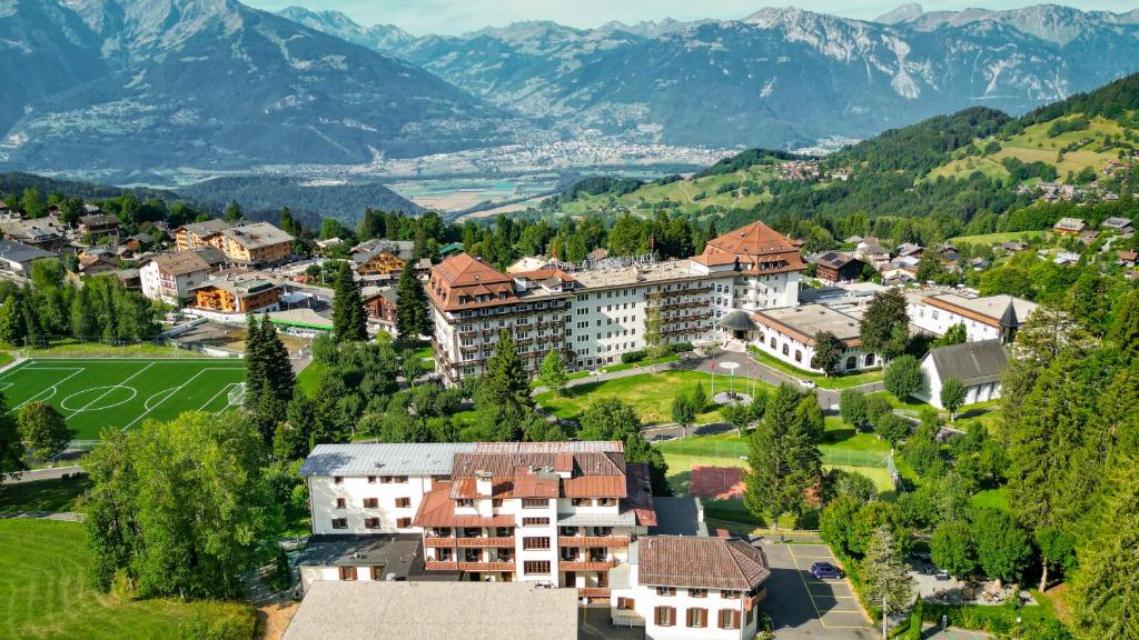 an aerial view of a town in the mountains at Villars Lodge in Villars-sur-Ollon