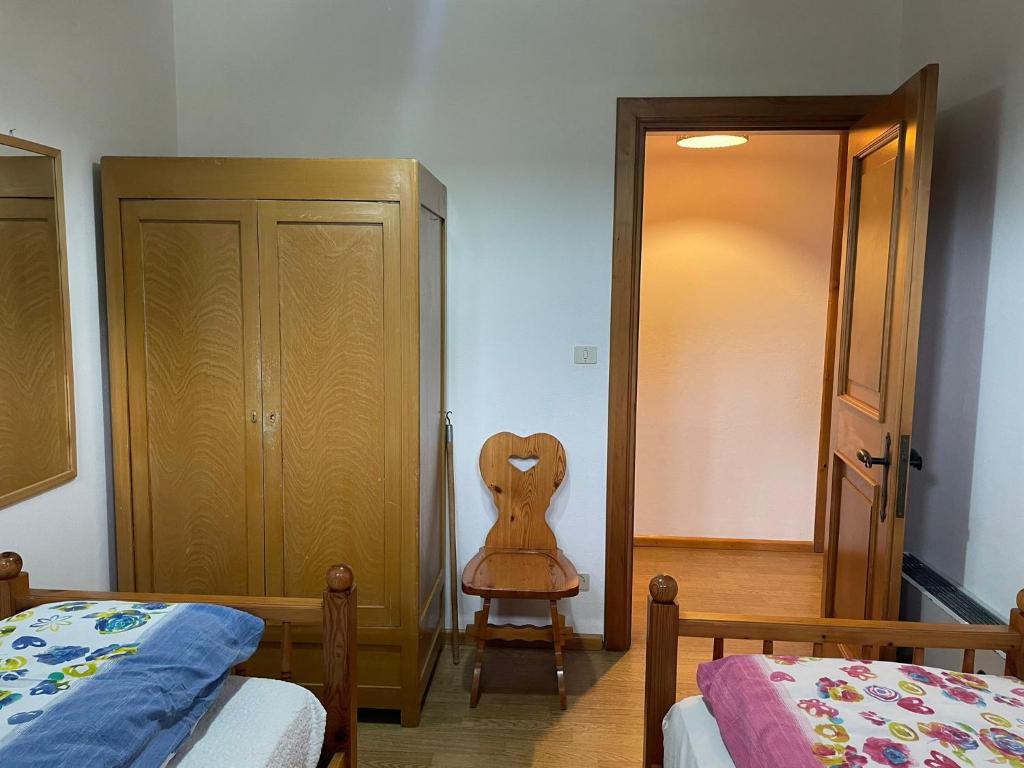 Postel nebo postele na pokoji v ubytování Mansarda Mulaz