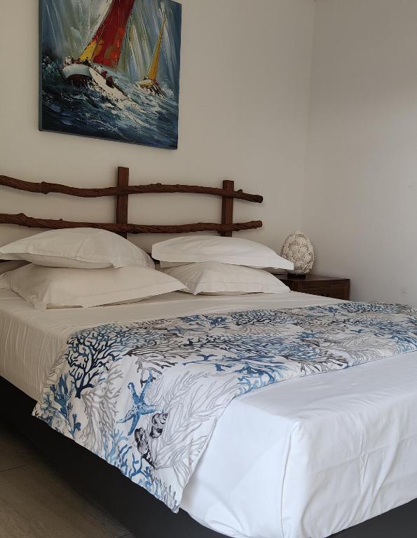 Postel nebo postele na pokoji v ubytování Majesty Palm Hôtel
