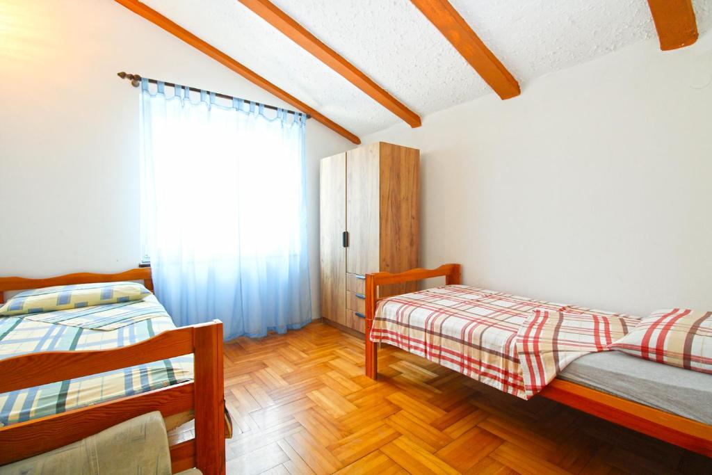 Postel nebo postele na pokoji v ubytování Apartments Otmar 1224