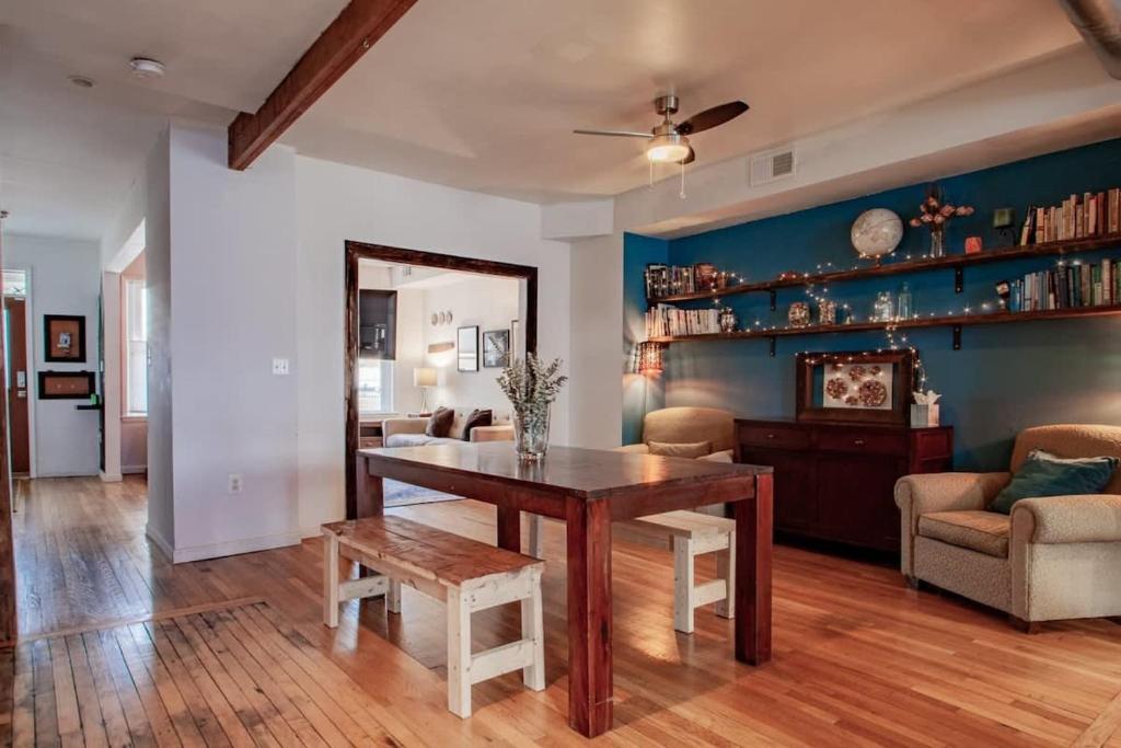 a living room with a wooden table and a couch at Inviting 3-Lvl DC Townhome Walk to METRO Station & Union Market H Street NoMa Union Station in Washington, D.C.