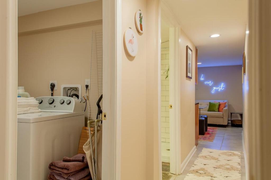 a kitchen with a sink and a stove in a room at 2-BR City Retreat Peace Privacy & Parking in Washington, D.C.